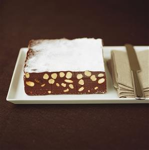 Chocolate nut cake with icing sugar