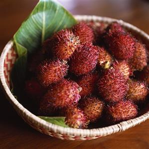 Several rambutans in a basket