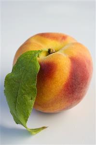 A peach with leaf