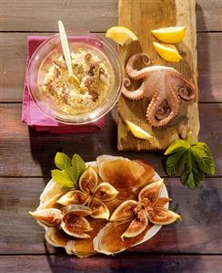 Pearl barley salad with octopus, ham with figs (Italy)