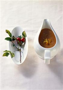 Savoury rose hip sauce in sauce-boat