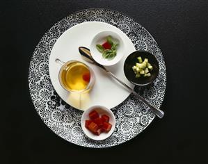 White tomato bouillon with various ingredients