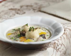 Goose soup with vegetables and dumplings