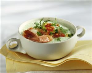 Cold cucumber soup with shrimps and diced peppers