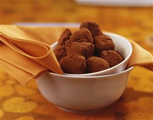 Orange sweets coated in cocoa powder