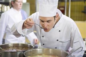 Chef tasting vegetable stock