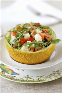 Savoury melon salad in hollowed-out melon