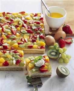 Sponge base topped with blancmange and fruit