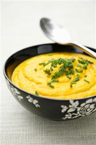 Carrot soup with snipped chives