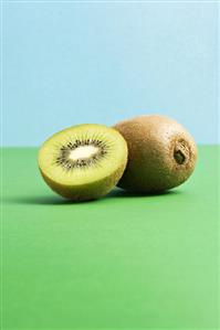 Kiwi fruits, whole and half