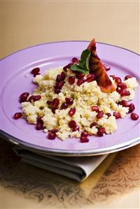 Couscous with pomegranate seeds, mint and blood orange