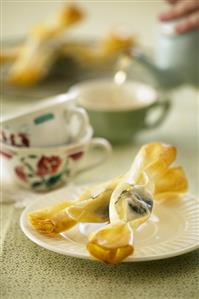 Deep-fried filo pastry sweets with chocolate filling, with tea