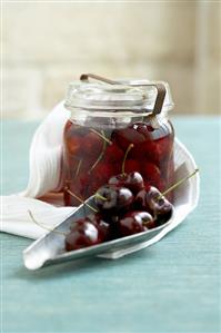 Pickled cherries in a preserving jar