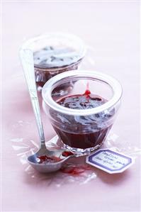 Two jars of cherry and redcurrant jam