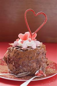 Chocolate cake decorated with sweets and sparkler