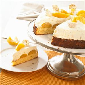 Coconut cake with fruit, a piece removed