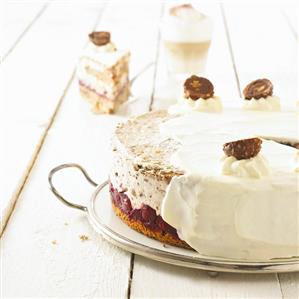 Nut cake with cherries and cream