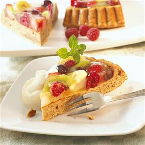 Three pieces of fruit flan with cream