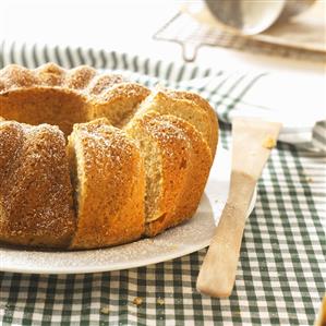 Ring-shaped apple sauce cake, partly sliced