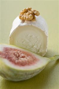 Goat's cheese with walnut, half a fig in foreground