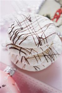 Coconut macaroons drizzled with couverture chocolate