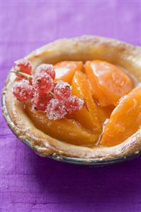 Apricot tart with sugared redcurrants