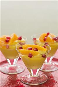 Saffron cream with pomegranate seeds and orange segments