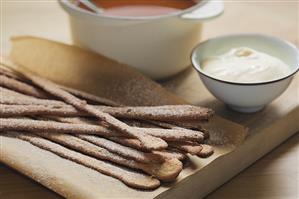 Almond sticks, rose hip soup and cream