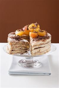 Oblatentorte (wafer cake) with coffee cream & apricots, a piece cut