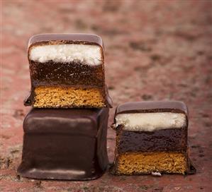 Dominosteine (layered gingerbread) on brick surface