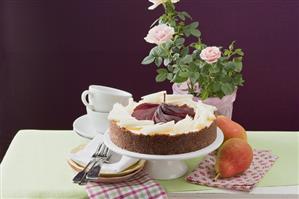 Cheesecake with red wine pears and white chocolate curls