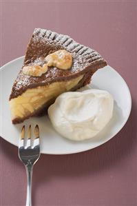 Piece of apple pie with whipped cream