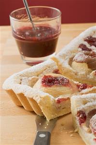 Baked apple cake with jam, pieces cut (close-up)