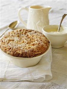 Fruit crumble with slivered almonds, custard