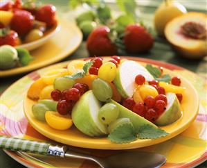 Fruit salad with apples, redcurrants, mirabelles & grapes