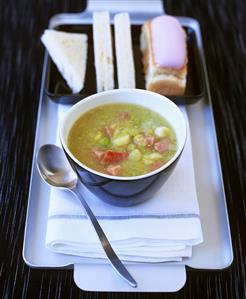 Pea soup with bacon, bread and ice cream cake