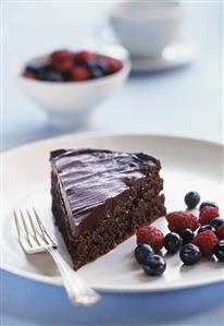 A piece of chocolate cake with berries