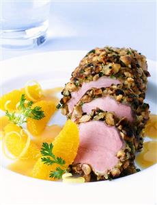 Pork fillet in peanut panade on spicy orange sauce