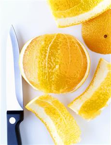 Peeling an orange with a knife