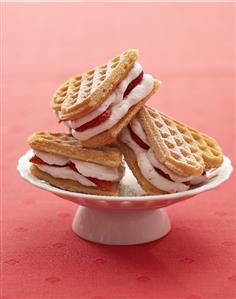 Heart-shaped waffles filled with strawberry cream