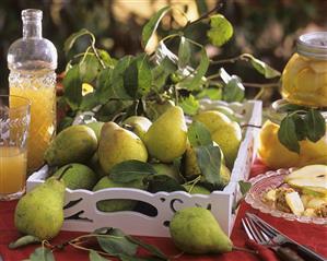 Pears on white wooden tray, pear juice and -compote