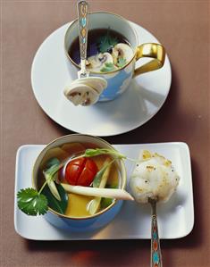 Clear mushroom consommé and lime broth with fish