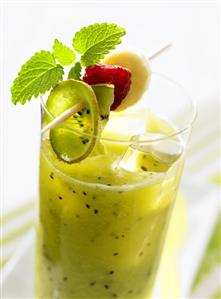 Kiwi fruit and banana drink with fruit on cocktail stick