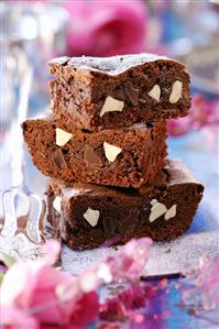 Three pieces of chocolate cake in a pile