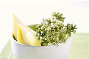 Oregano with lemon wedges