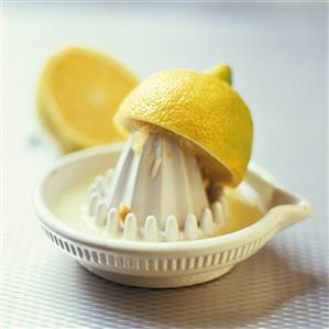 Lemon half on lemon squeezer