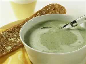 Broccoli soup with cheese and garlic baguette