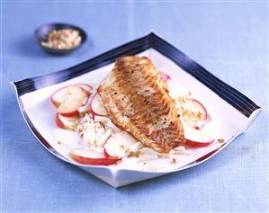 Fried fillet of perch on celery and apple