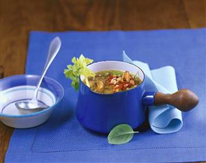 Mussel soup with vegetables and basil