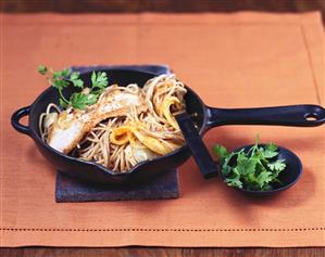 Turkey escalope and fried noodles with mango